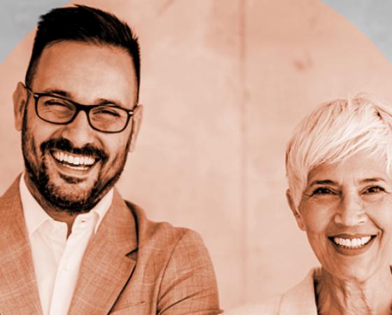 Image of professional man and woman in black and white with orange circle overlapping the image. 